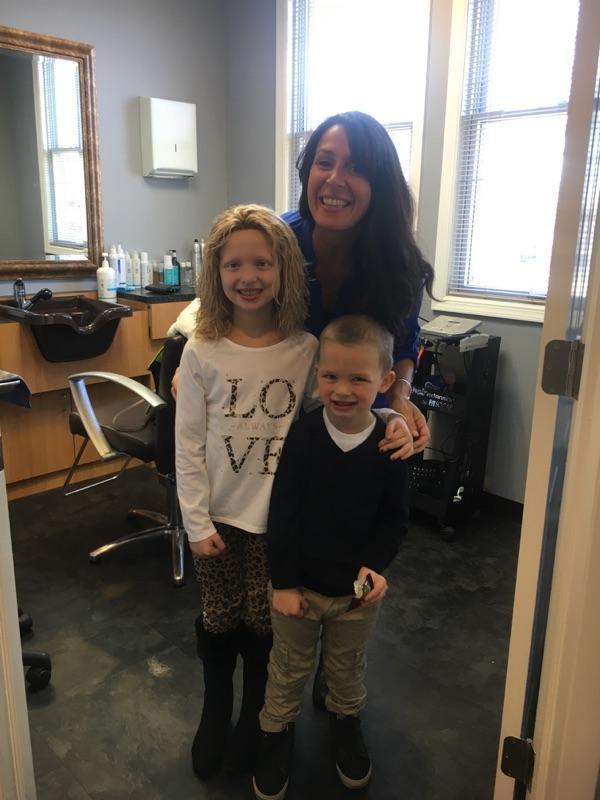 Amelia Sholty with Transitions Hair Solutions owner Danielle Marzella and her little brother Liam.